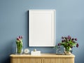 Interior frame photo mockup with vertical empty wooden cabinet,blue wall Royalty Free Stock Photo