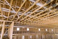 Interior framing of a new house under construction with roof trusses built frame