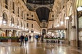 Interior of Galleria Vittorio Emanuele II. The Oldest Active Shopping Gallery in Italy. People Shop and Eat Inside of the Arcade
