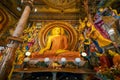 Colombo, Sri Lanka - November 19, 2019: Interior of Gangaramaya Buddhist Temple with large Buddha statue and shrine