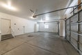 Interior of a garage with double automatic doors and concrete floor Royalty Free Stock Photo