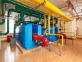 Interior gas boiler house with a lot of industrial boilers, pipe