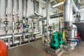 Interior gas boiler room with multiple pumps and piping Royalty Free Stock Photo