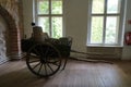 A horse cart with accessories for repairing and cleaning stoves is in the Gothic House in the old town of Spandau.