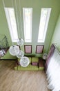 Interior in green and pink colors with green sofa and light parquet Royalty Free Stock Photo