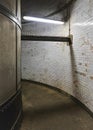 Interior of Greenwich foot tunnel, dirty grunge walls and floor in narrow corridor lit by neon light Royalty Free Stock Photo