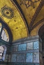 The interior of Hagia Sophia, sheathed with polychrome marbles, green and white with purple porphyry, and gold mosaics