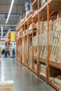 interior of hardware retailer with aisles, shelves, racks of building material insulation floor to ceiling Royalty Free Stock Photo