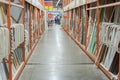 interior of hardware retailer with aisles, shelves, racks of building material insulation floor to ceiling. Royalty Free Stock Photo