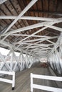 Interior of historic, white covered bridge, Groveton, New Hampshire. Royalty Free Stock Photo