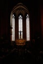 Interior of the historical cathedral in Frankfurt in Germany with long windows and crucifix of Jesus
