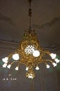 The interior of the Hofburg Palace in Vienna. Golden interior details.