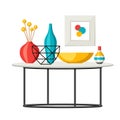 Interior home decor. Table with vases and picture.