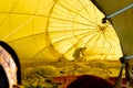 Interior of a hot air balloon with a shadow of a person in backlighting