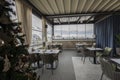 Interior of a hotel restaurant with decorated Christmas tree