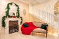 Interior house fireplace and mirror Christmas tree decorated, red and green color Royalty Free Stock Photo