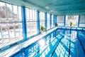 An interior of an indoor public swimming pool. Royalty Free Stock Photo