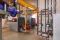 Interior of industrial, gas boiler room with boilers; pumps; sensors and a variety of pipelines