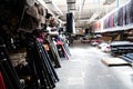 Interior of an industrial warehouse with fabric rolls samples. Small business textile colorful warehouse. Royalty Free Stock Photo