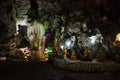 Interior inside cavern of Wat Tham Nam or Water Cave Temple for thai people visit respect praying blessing ancient buddha and