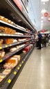 Interior inside view of an Aldi supermarket shop store showing food for sale on display in chillers