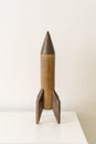 Interior kids design, wooden rocket, vintage skyrocket toy, residence nursery decor, old plaything Royalty Free Stock Photo