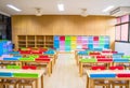 Interior of kindergarten classroom consist desks and chairs