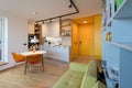 Interior of kitchen with dining table in urban apartment Royalty Free Stock Photo