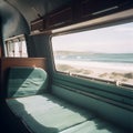 Interior of large caravan auto trailer, outside window sees beautiful natural landscape sea and beach