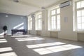 Interior of a large empty room of a big modern unfurnished apartment on a sunny day Royalty Free Stock Photo