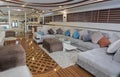 Interior of large salon area of luxury motor yacht