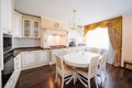 The interior of a large and spacious kitchen-living room in a classic style. Royalty Free Stock Photo