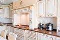 The interior of a large and spacious kitchen-living room in a classic style. Royalty Free Stock Photo