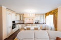 The interior of a large and spacious kitchen-living room in a classic style. Royalty Free Stock Photo