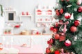 Interior light grey kitchen and red christmas decor. Preparing lunch at home on the kitchen concept. Royalty Free Stock Photo
