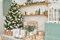 Interior light kitchen with christmas decor and tree. Turquoise-colored kitchen in classic style. Christmas in the kitchen. Bright Royalty Free Stock Photo