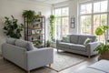 Light living room with grey sofas and plants Royalty Free Stock Photo