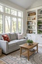 Interior of light living room with grey sofa, table and shelving units Royalty Free Stock Photo