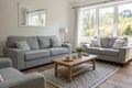 Interior of light living room with grey sofas, coffee table and large window Royalty Free Stock Photo