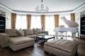 Interior of light living room with white piano