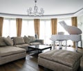 Interior of light living room with white piano