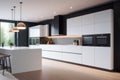 The interior of a light, minimalist kitchen with an island countertop in the center. Kitchen layout