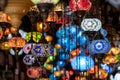 Interior of light shop in Camden Market in north London, with colourful glass hanging lamps in oriental style. Royalty Free Stock Photo