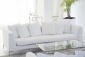 Interior of the living room of the hotel. Beautiful living room with white sofa. White Concept Living Room Interior. Modern bed Royalty Free Stock Photo