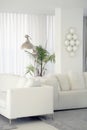 Interior of the living room of the hotel. Beautiful living room with white sofa. White Concept Living Room Interior. Modern bed Royalty Free Stock Photo