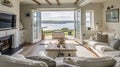 Interior of a living room with white walls, sofa and cushions. Sitting room in coastal cottage with sea view Royalty Free Stock Photo