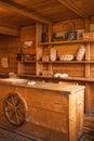 Interior of a local bakery shop decorated with wooden antique furniture. Bakery Display with different kinds of breads