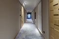 Interior of a long hotel corridor Royalty Free Stock Photo