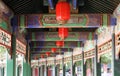 Interior of the Long traditional Corridor with highly decorated painted ceiling. Walkway through the Summer Palace, Beijing, China Royalty Free Stock Photo