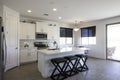 Interior looking of a kitchen with white cabinets of a typical Single family house